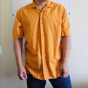 Uniqlo orange button down shirt